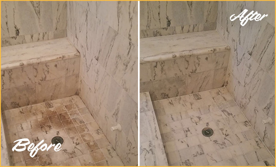 Before and After Picture of a Dirty Indian Harbour Beach Marble Shower Cleaned to Eliminate Dark Stains