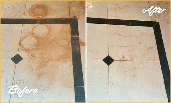 Before and After Picture of a Cocoa Hard Surface Restoration Service on a Marble Floor to Eliminate Rust Stains